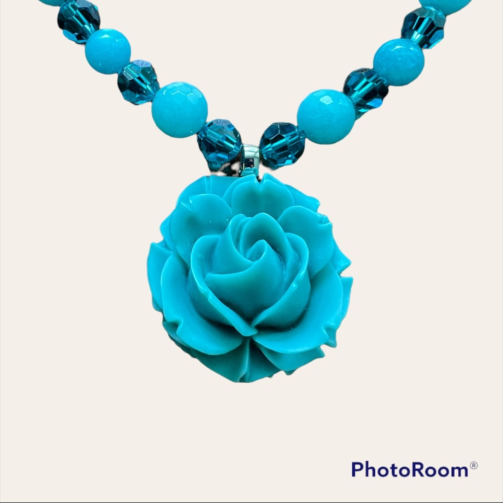Handmade teal necklace with rose pendant.